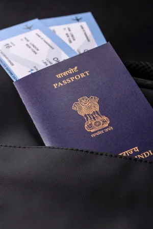 257194579-passport-india-visa-for-travel-document-with-tickets-in-travel-bag-indian-passport-as-background-for